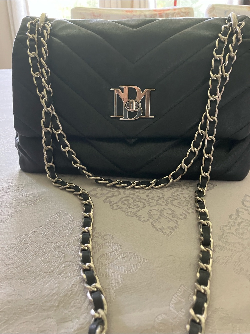 Black Quilted Shoulder Bag with Silver Chain and Monogram Accent